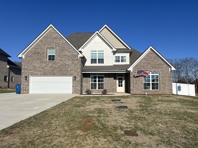 view of front of home featuring a garage and a front yard