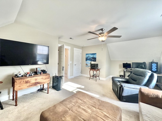 carpeted living room with vaulted ceiling and ceiling fan