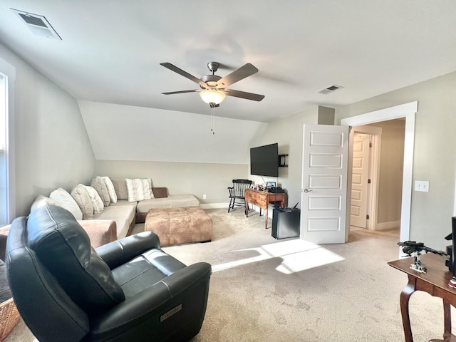 carpeted living room featuring ceiling fan and lofted ceiling