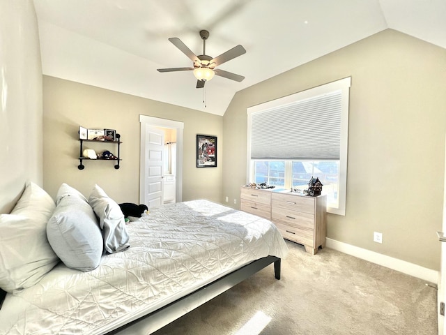 carpeted bedroom with ceiling fan and lofted ceiling