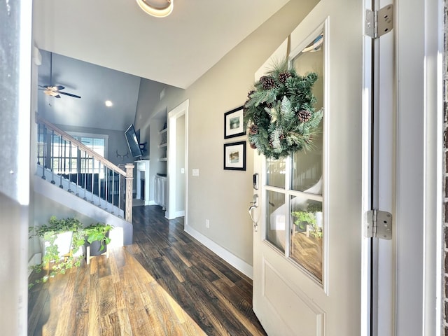 entrance foyer featuring dark wood-type flooring, lofted ceiling, and ceiling fan