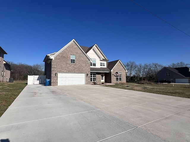 view of front of home with central air condition unit and a garage