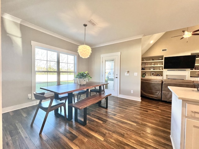 dining room featuring ceiling fan, built in shelves, dark hardwood / wood-style flooring, and vaulted ceiling