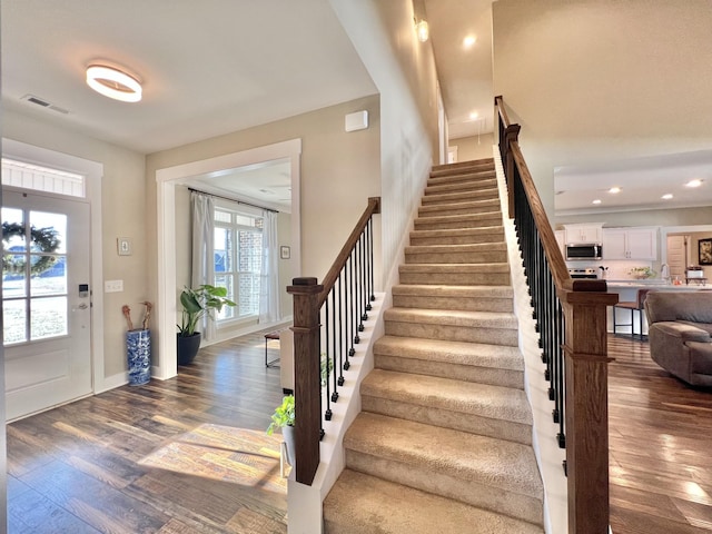 foyer with dark hardwood / wood-style flooring