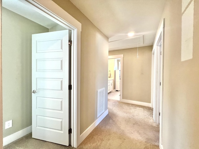 corridor with light carpet