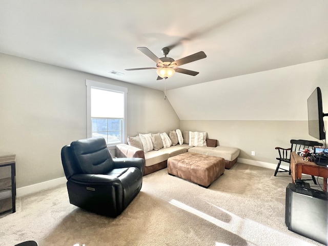 carpeted living room with ceiling fan and lofted ceiling