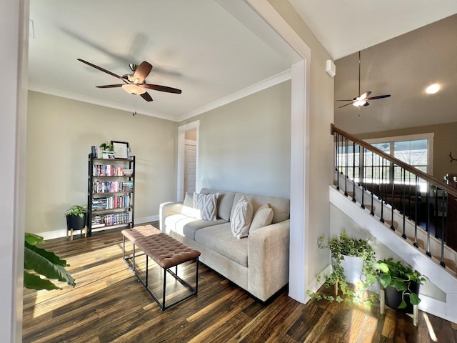 living room with ceiling fan, dark hardwood / wood-style flooring, and ornamental molding