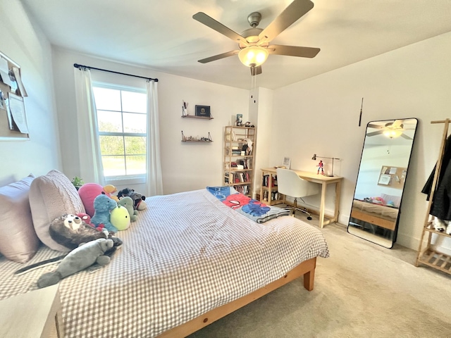 bedroom featuring ceiling fan and light colored carpet