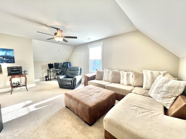 carpeted living room featuring ceiling fan and lofted ceiling