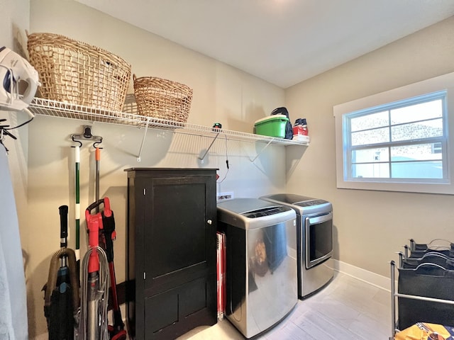 laundry room featuring washing machine and clothes dryer