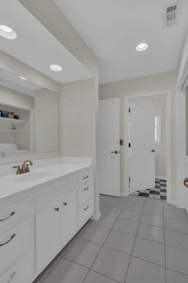 bathroom featuring vanity and tile patterned flooring