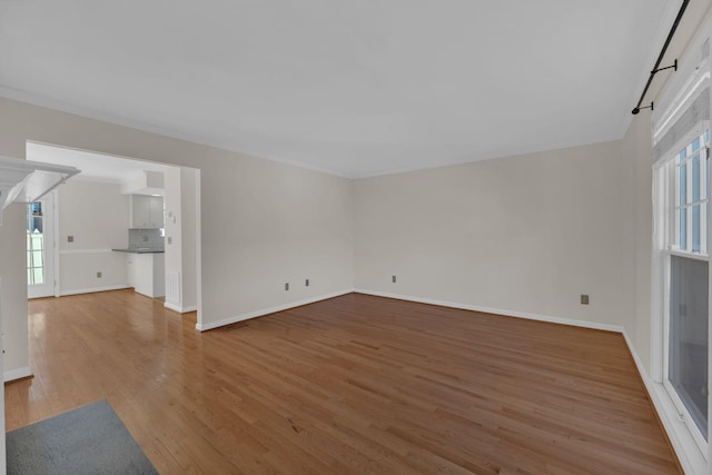 unfurnished living room featuring hardwood / wood-style flooring