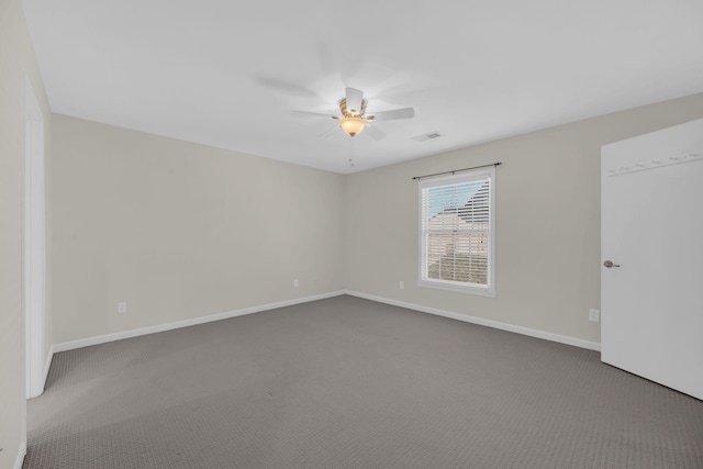 carpeted empty room featuring ceiling fan