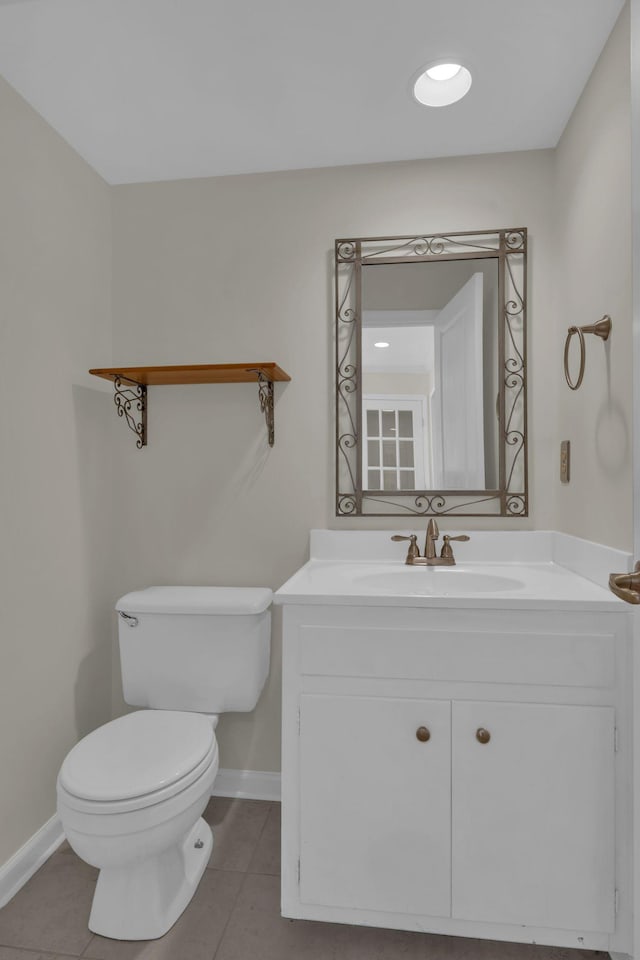 bathroom with tile patterned floors, toilet, and vanity