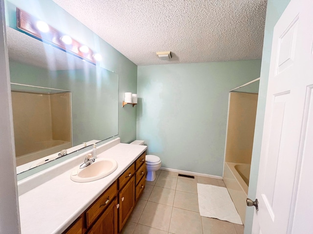 full bathroom with a textured ceiling, tile patterned floors, vanity, shower / bath combination, and toilet