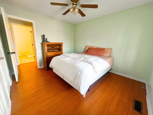 bedroom featuring ceiling fan and hardwood / wood-style floors