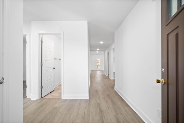 hall with light hardwood / wood-style floors