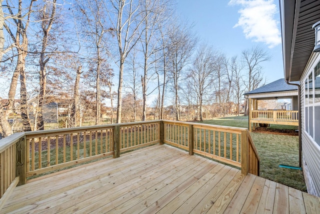 deck featuring a lawn