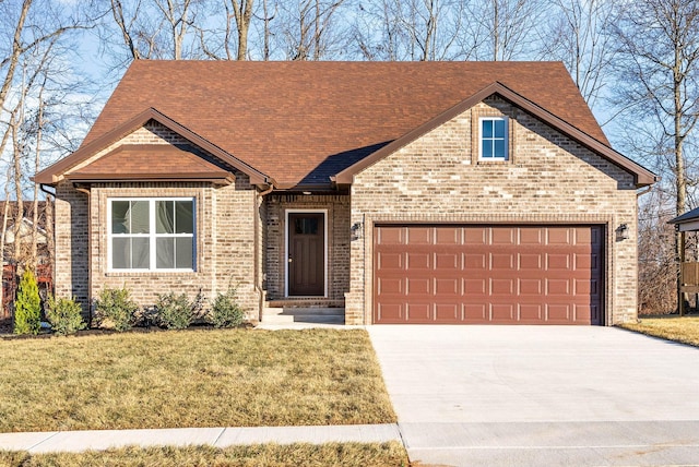 view of front of house featuring a front lawn and a garage