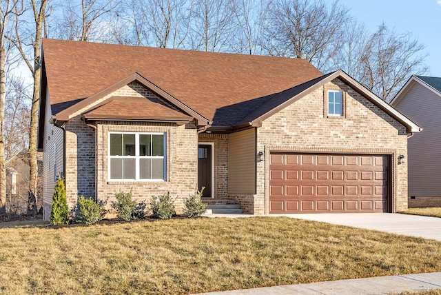 view of front of property featuring a front lawn and a garage