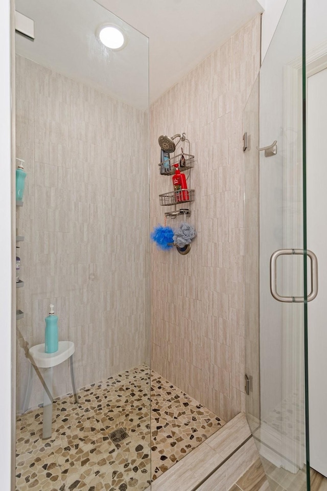 bathroom featuring an enclosed shower