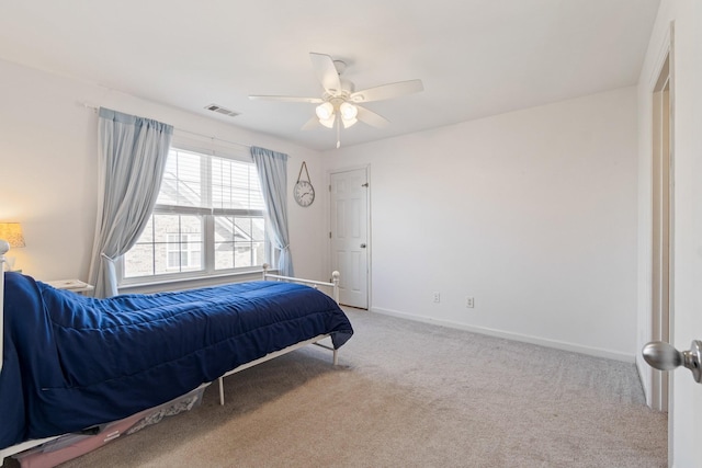 bedroom featuring ceiling fan and carpet