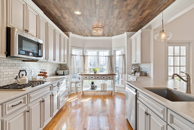 kitchen featuring light stone countertops, wood ceiling, sink, pendant lighting, and stainless steel appliances