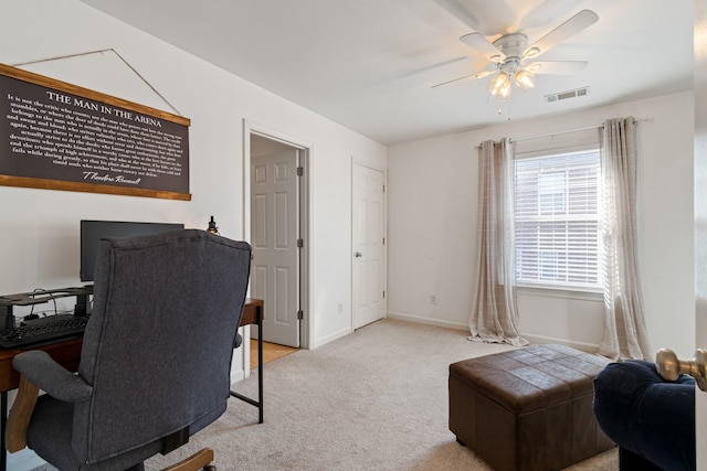 office featuring light carpet and ceiling fan