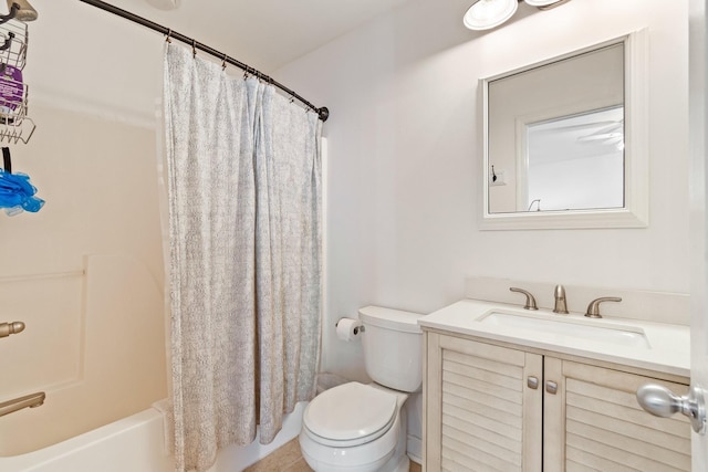 full bathroom with shower / bath combo with shower curtain, toilet, and vanity