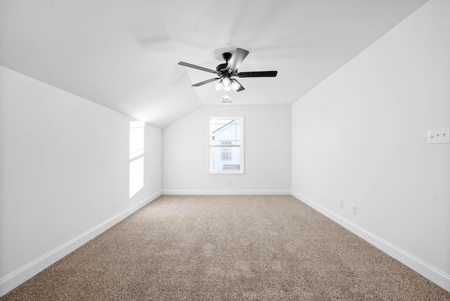 bonus room featuring ceiling fan, vaulted ceiling, and carpet flooring