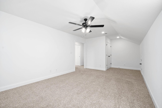 bonus room with ceiling fan, lofted ceiling, and light colored carpet