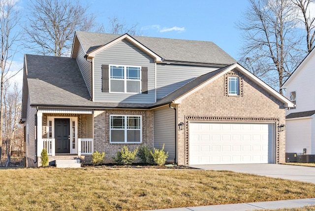 front of property with a front lawn and a garage