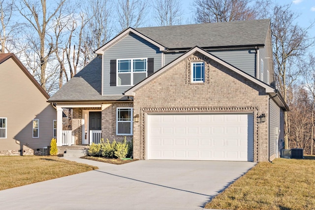 view of front of house featuring a garage and a front lawn