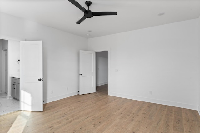 unfurnished room featuring light hardwood / wood-style floors and ceiling fan