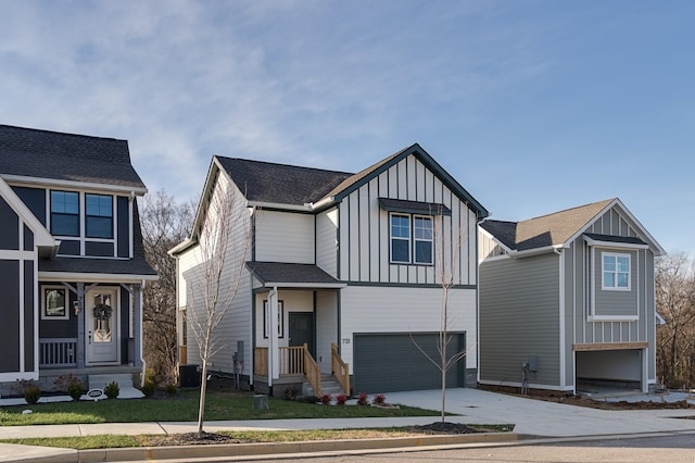 view of front facade with a garage and cooling unit