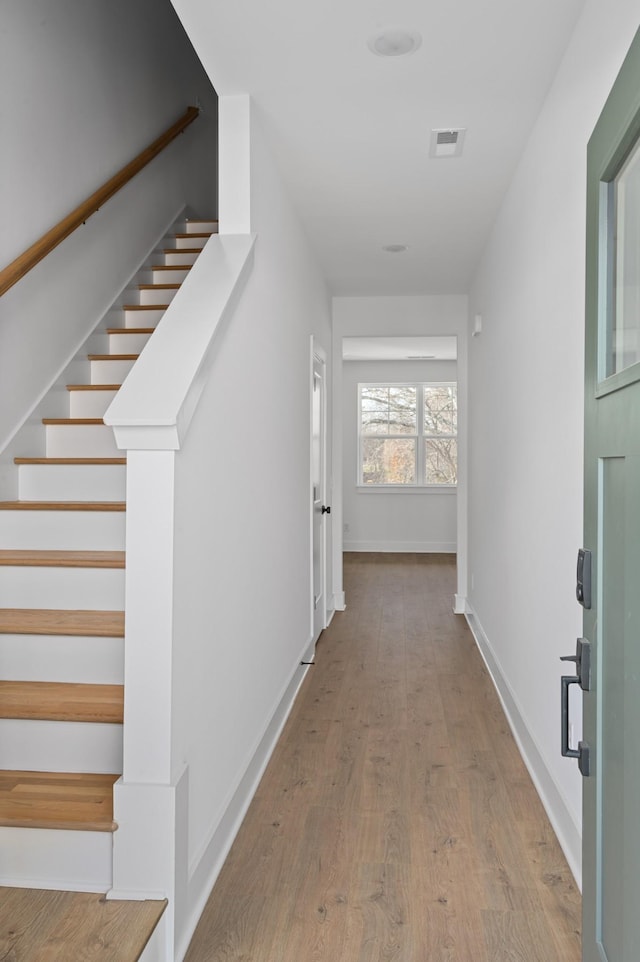 hallway featuring light wood-type flooring