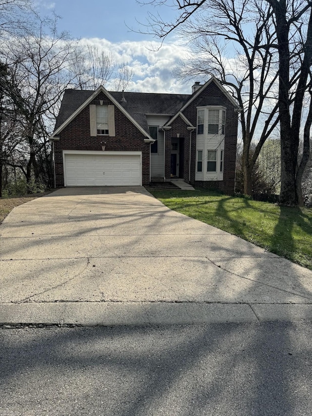 view of front facade featuring a garage and a front yard