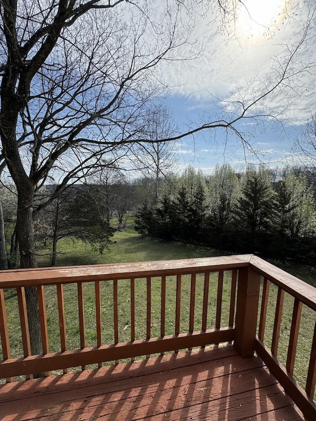 wooden deck with a yard