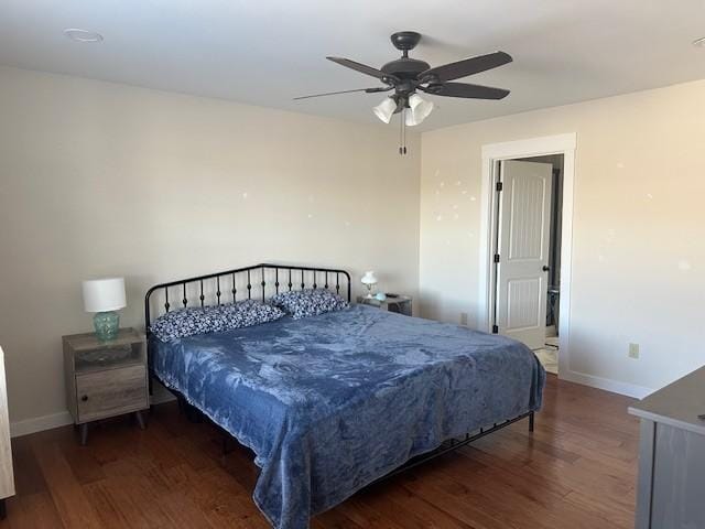 bedroom with ceiling fan and dark hardwood / wood-style flooring