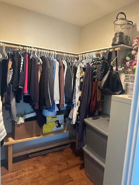 spacious closet featuring dark hardwood / wood-style floors