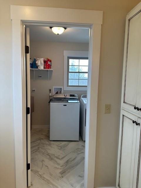 clothes washing area featuring washer and dryer