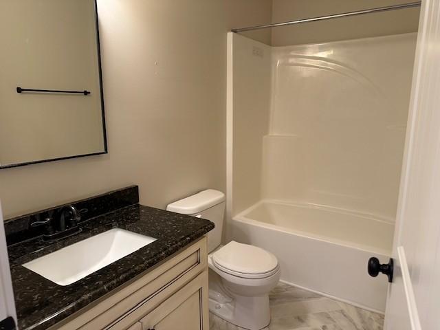 full bathroom with toilet, vanity, and shower / bathing tub combination