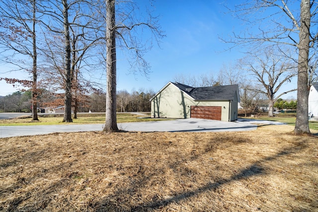 exterior space featuring a yard and a garage