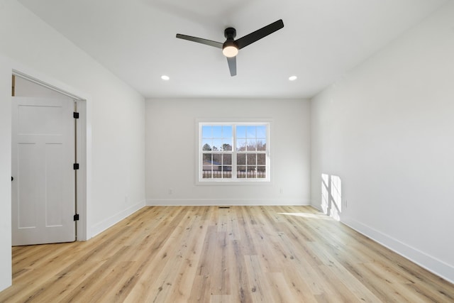 unfurnished room featuring ceiling fan and light hardwood / wood-style floors