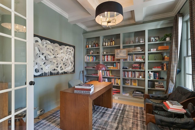 office area with coffered ceiling, ornamental molding, beam ceiling, and hardwood / wood-style floors