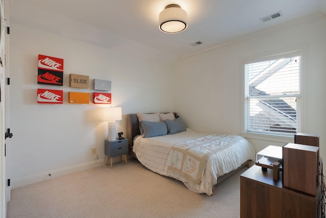 bedroom featuring carpet and ornamental molding