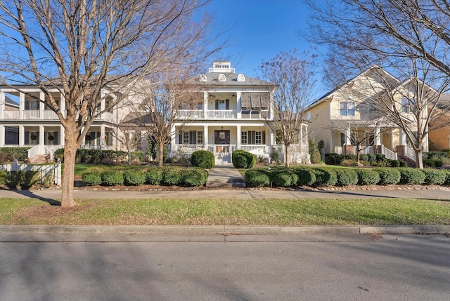 view of front of home with a balcony