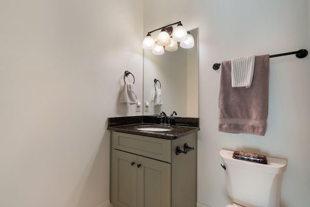 bathroom featuring toilet and vanity