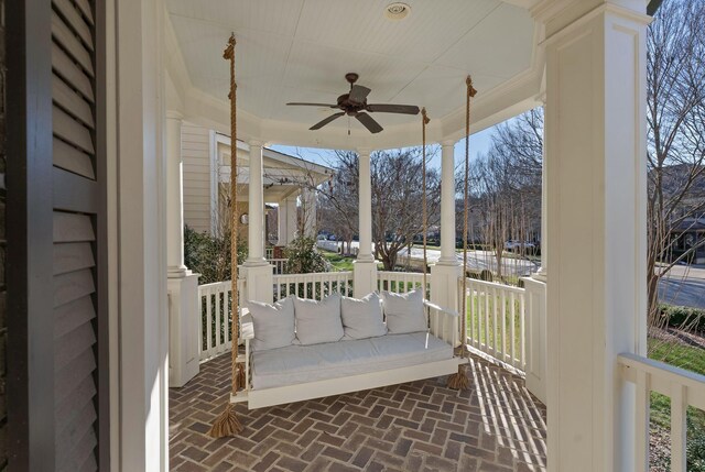 exterior space featuring ceiling fan