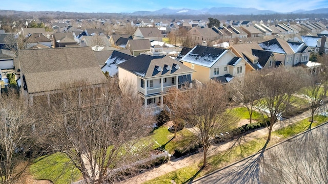 birds eye view of property with a mountain view